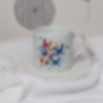 bright watercolour illustration of a swarm of Butterflies on a white ceramic mug