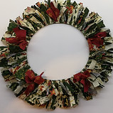 Rag Wreath made from fabric strips usning tradiotional Christmas reds, greens and golds