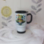 White steel travel mug with illustration of a gnome with a green hat adorned with butterflies and flowers