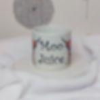 white 6oz ceramic mug with watercolour rainbow highland cow and "Moo Juice" slogan