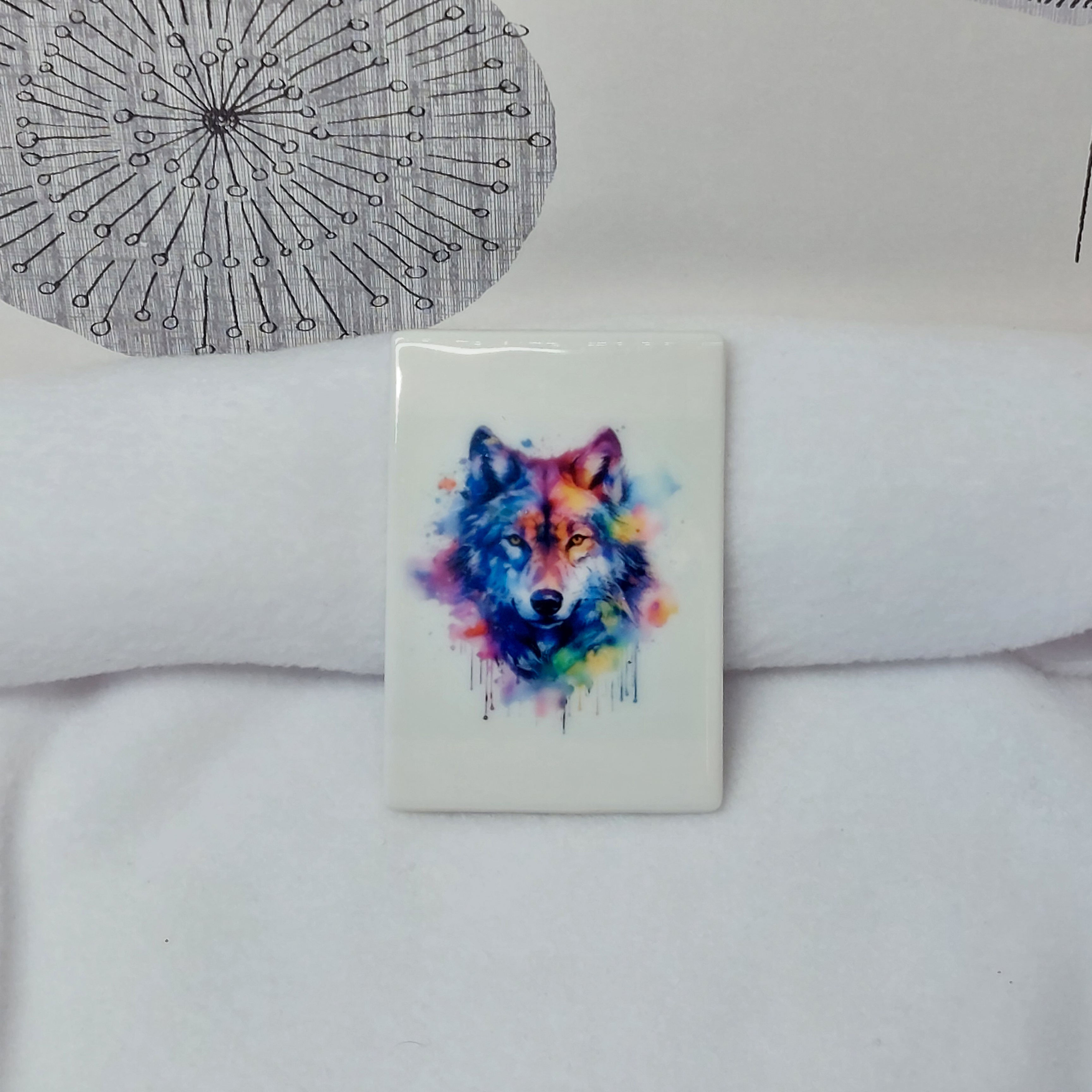 Vibrant rainbow watercolour Wolf head with puffs, splashes and drips of paint