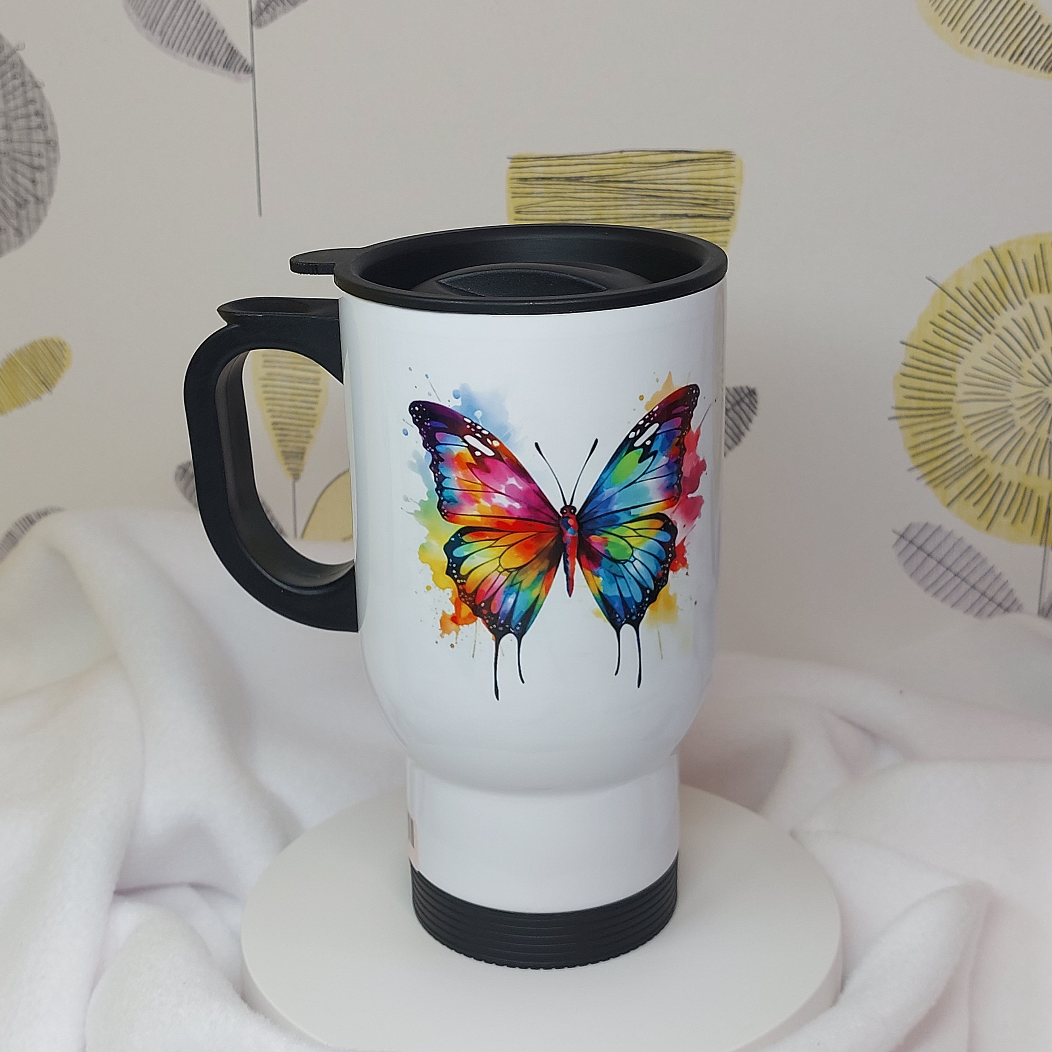 Watercolour Butterfly in rainbow colours paint splash, White Stainless Steel Travel Mug, black plastic handle & closeable lid