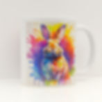 White ceramic mug with bright watercolour bunny with explosion of paint splashes and drips