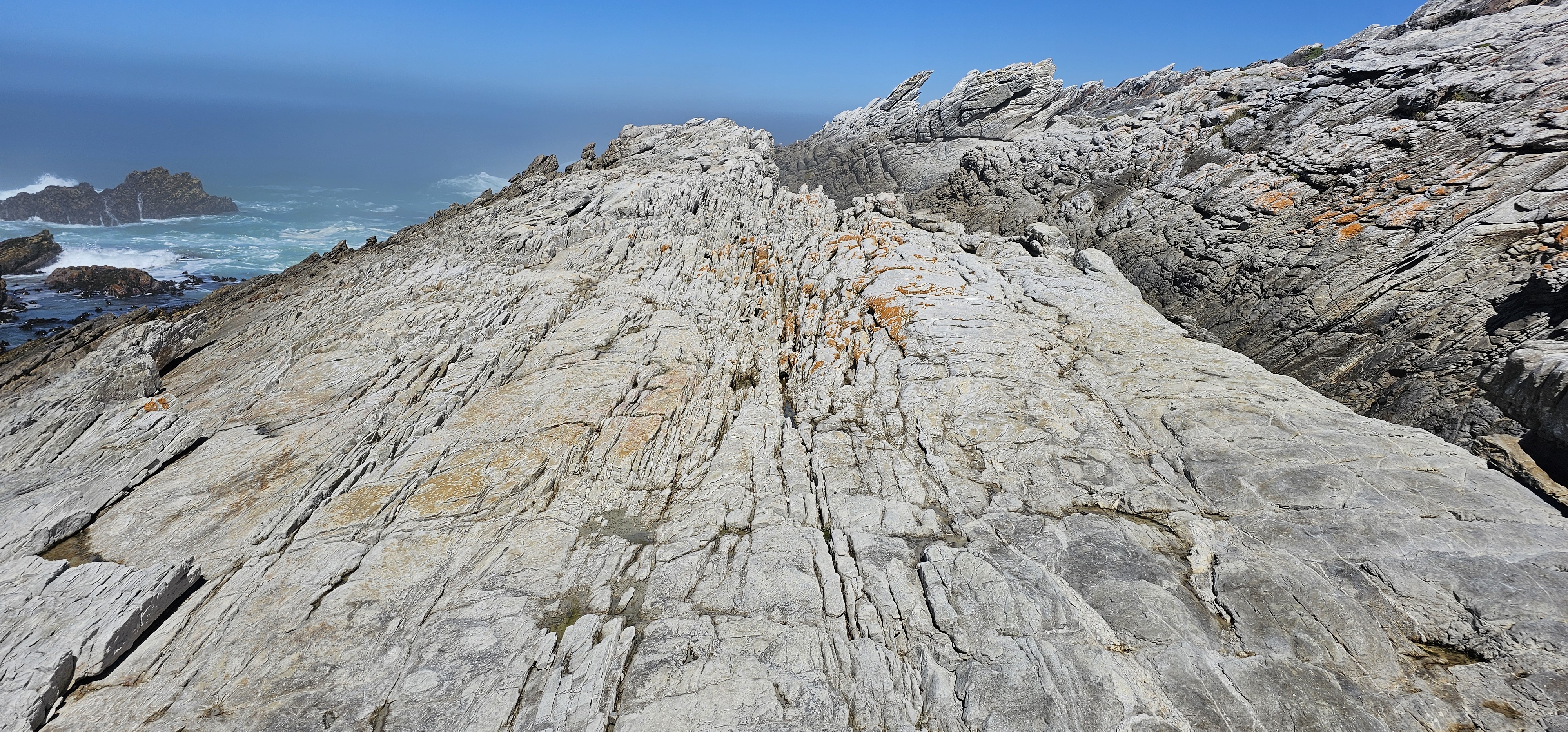 Quartzitic sandstone rock formations along the Cape Agulhas coastline