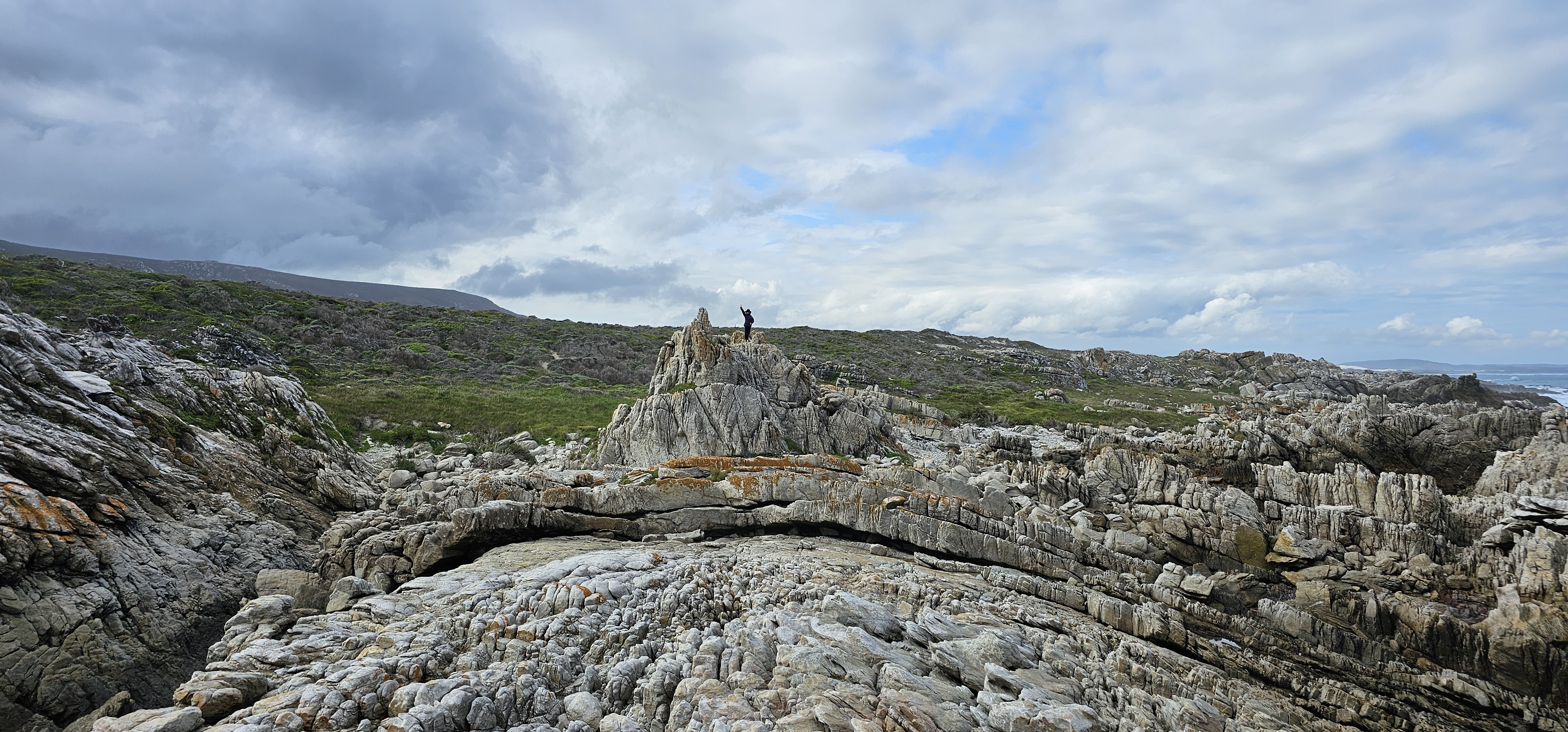 Cape Agulhas coastline with crystal-clear tidal pools and quartzitic sandstone rock formations