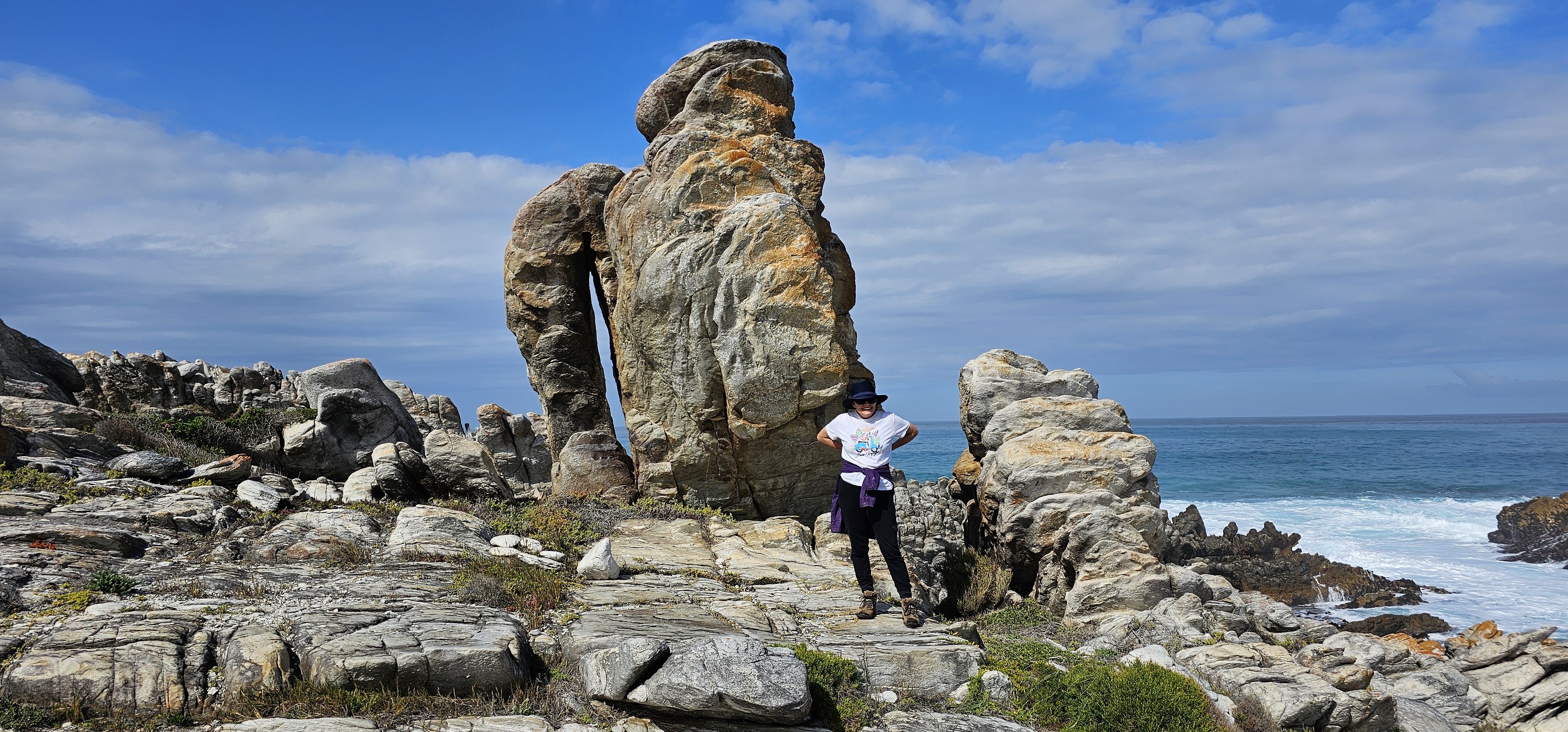 Hiker on the Cape Agulhas coastal trail overlooking the Indian Ocean
