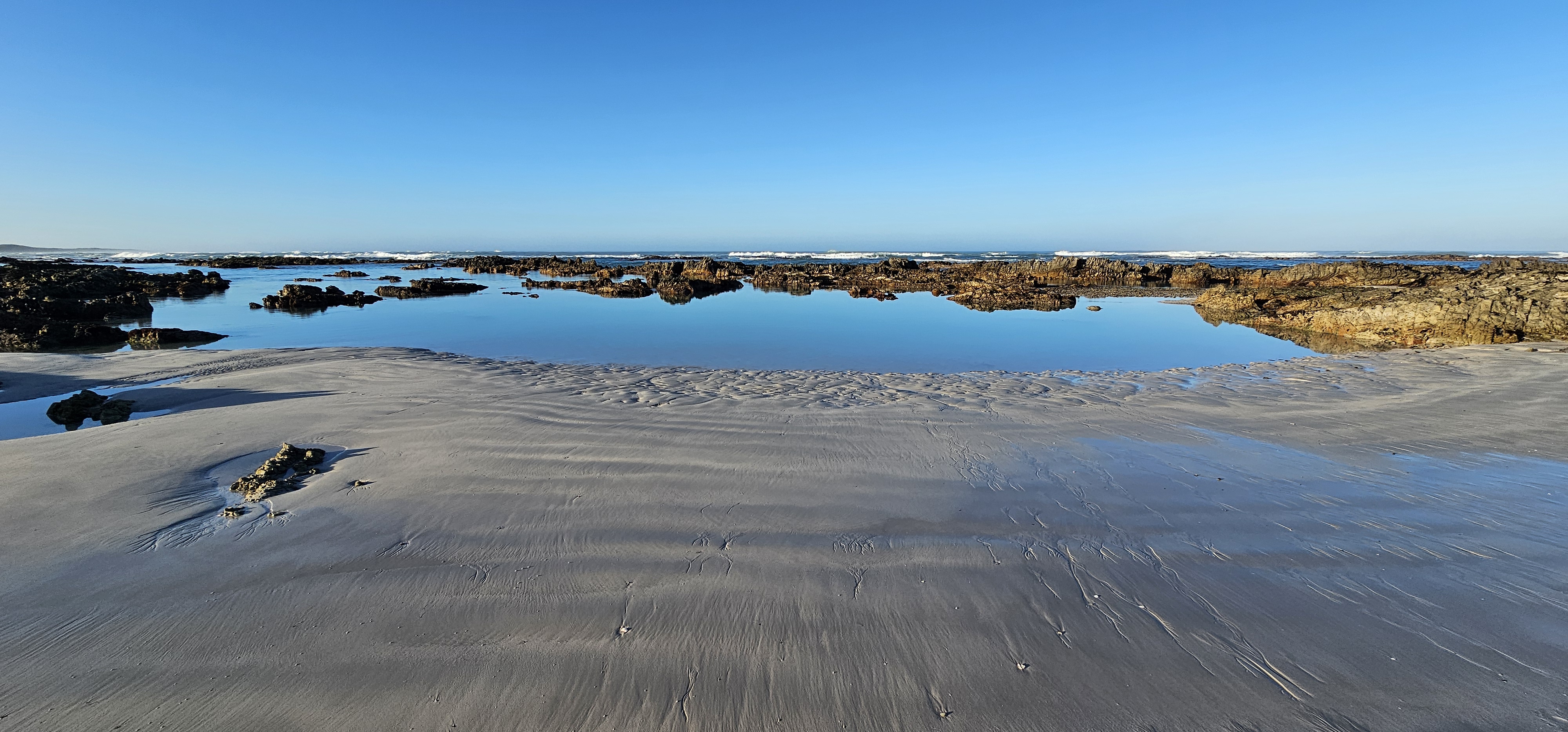 Crystal-clear tidal pools teeming with marine life at Cape Agulhas