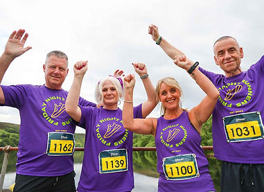 running club members celebrating before the X Trail 10K