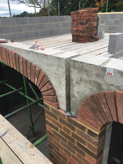 A brick archway under construction