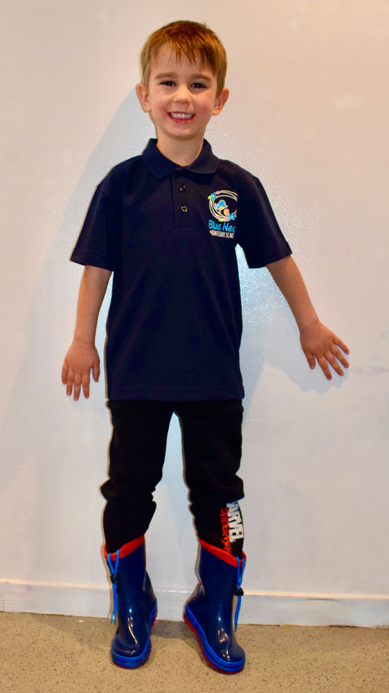 Thumbnail: Child Wearing Blue Nest Montessori Uniform