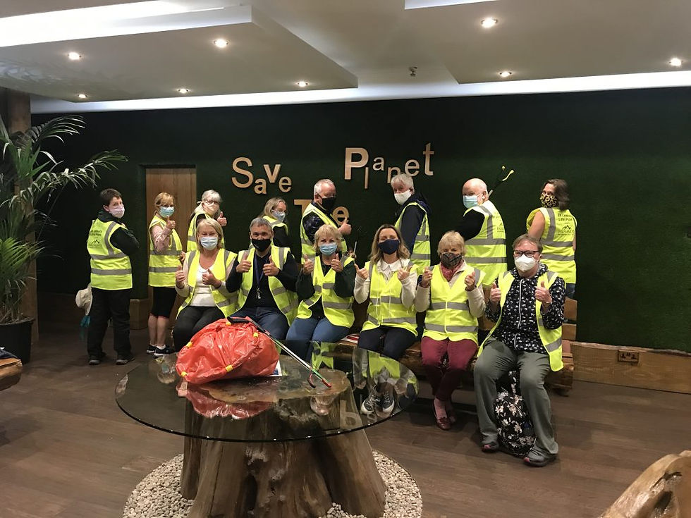 Group photo of EK Community Litter Pickers volunteers giving thumbs up together