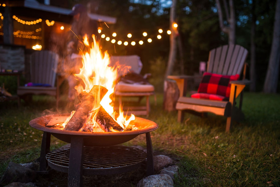 A burning fire pit illuminating in an outdoor setting