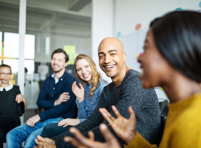 Group of people talking and smiling