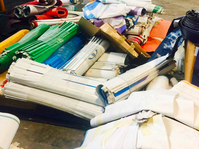 Pile of rolled-up materials in various colours