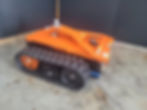 Close-up of orange Robik Lizard S electric mover featuring durable tracked tyres