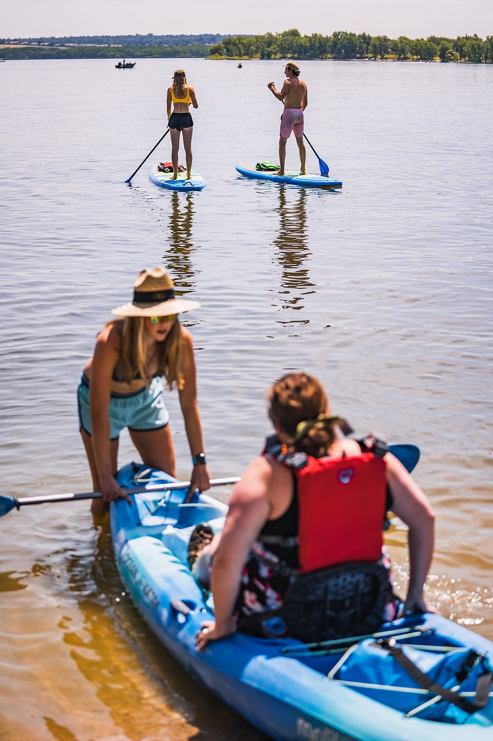 People kayaking near the shore