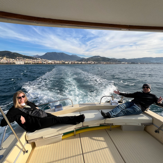couple on back of boat in amalfi coast