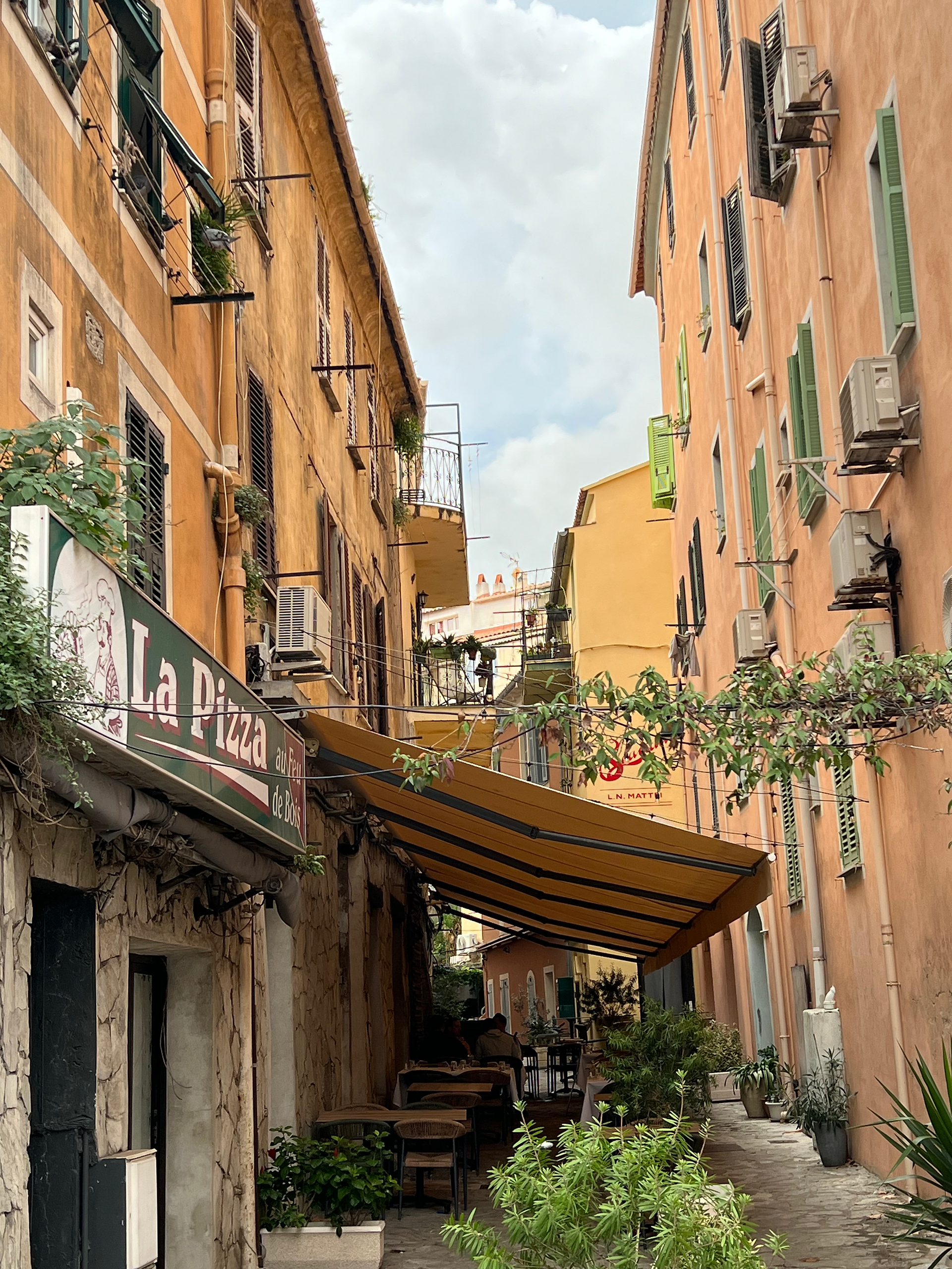 alleyway with pizza place in ajaccio