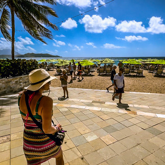 girl walking onto a beach resort