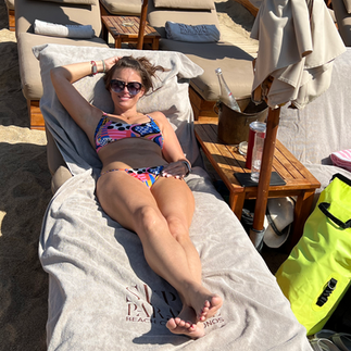 girl on lounger in super paradise beach club