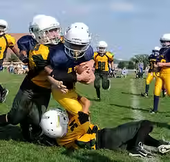 our mission section-kids playing football.avif