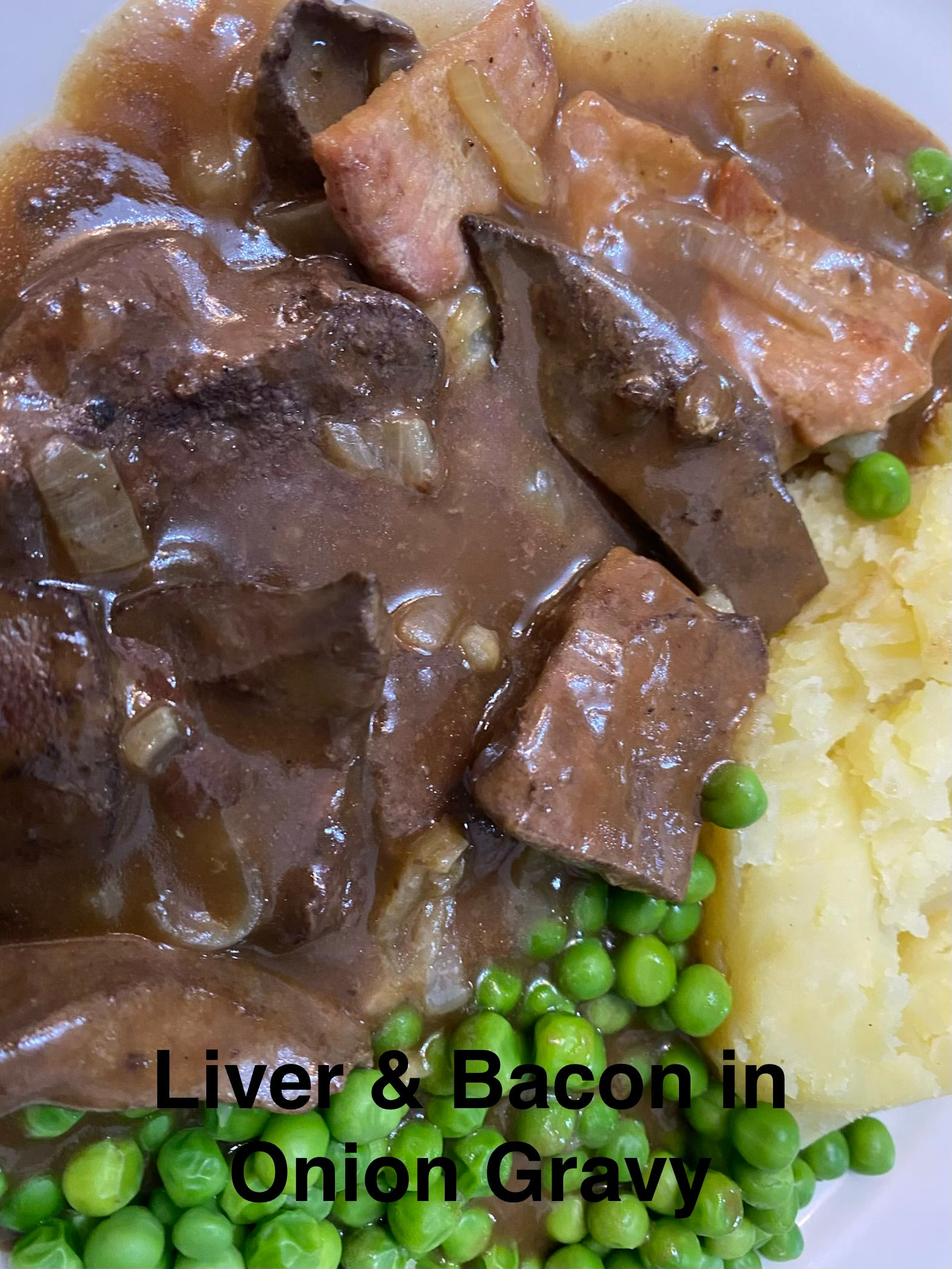 Liver and bacon in onion gravy with mash and peas