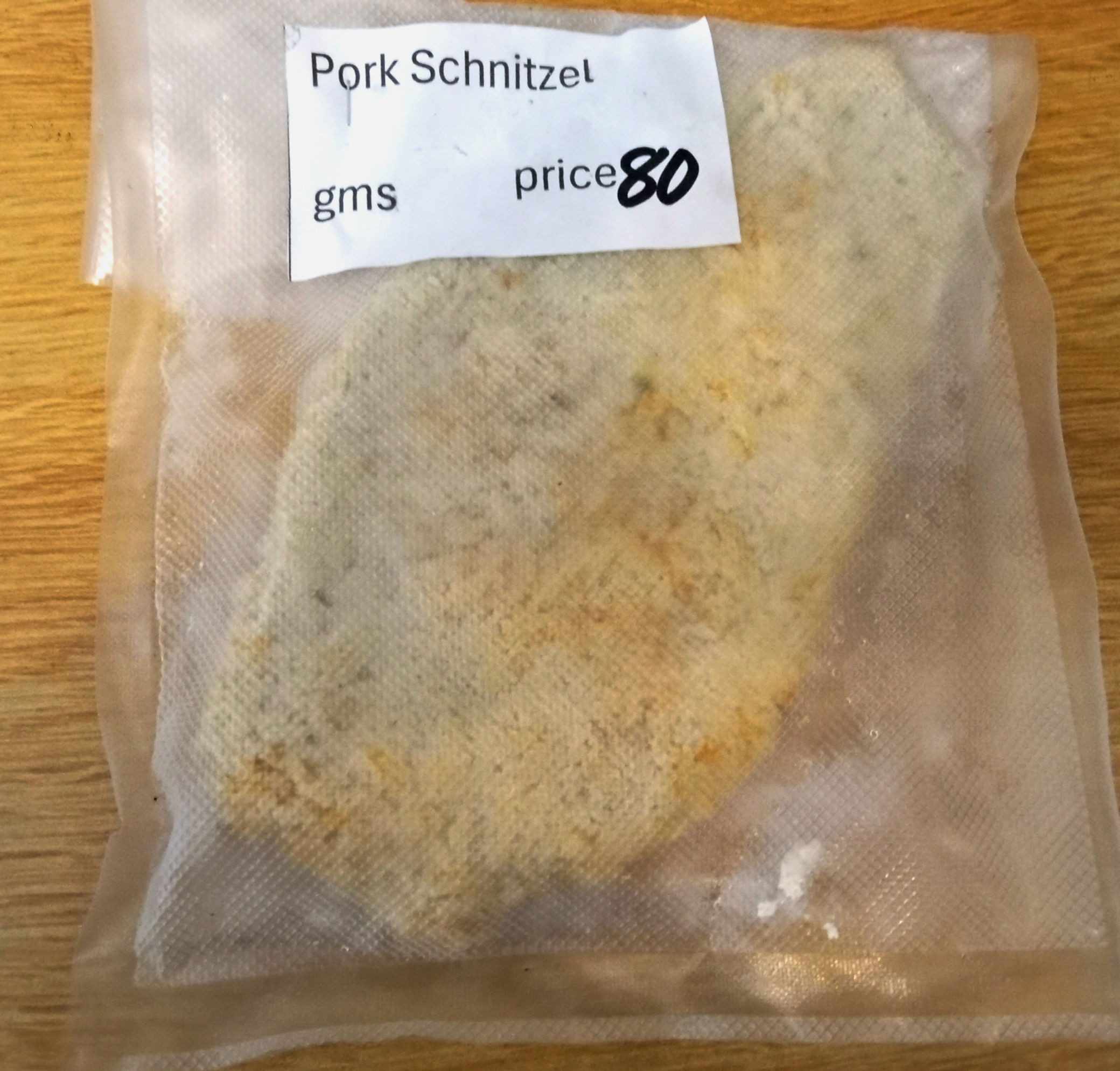 Pork schnitzel individually priced in a vacuum-sealed bag