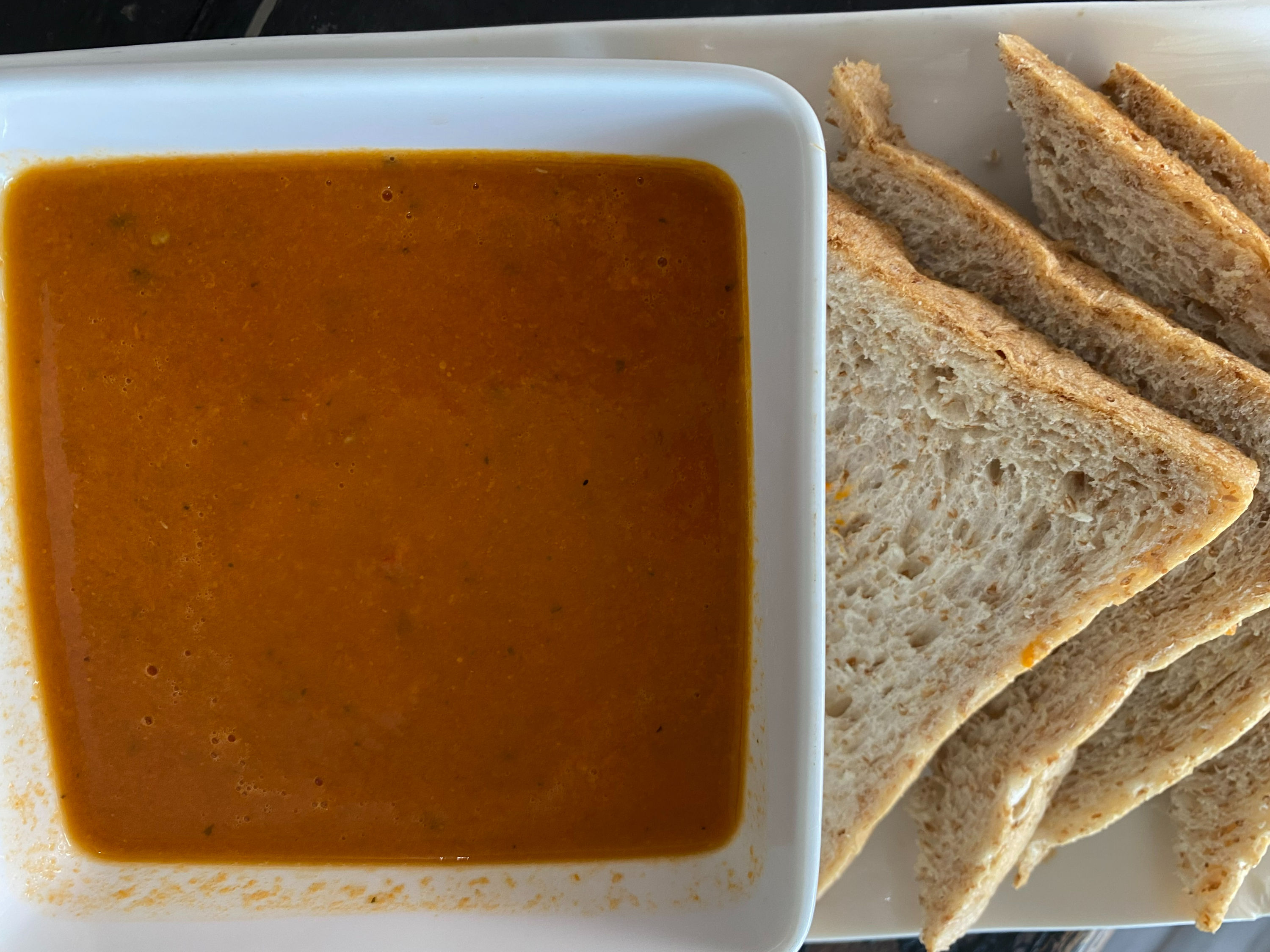Bowl of tomato and basil soup ready to re-heat homemade