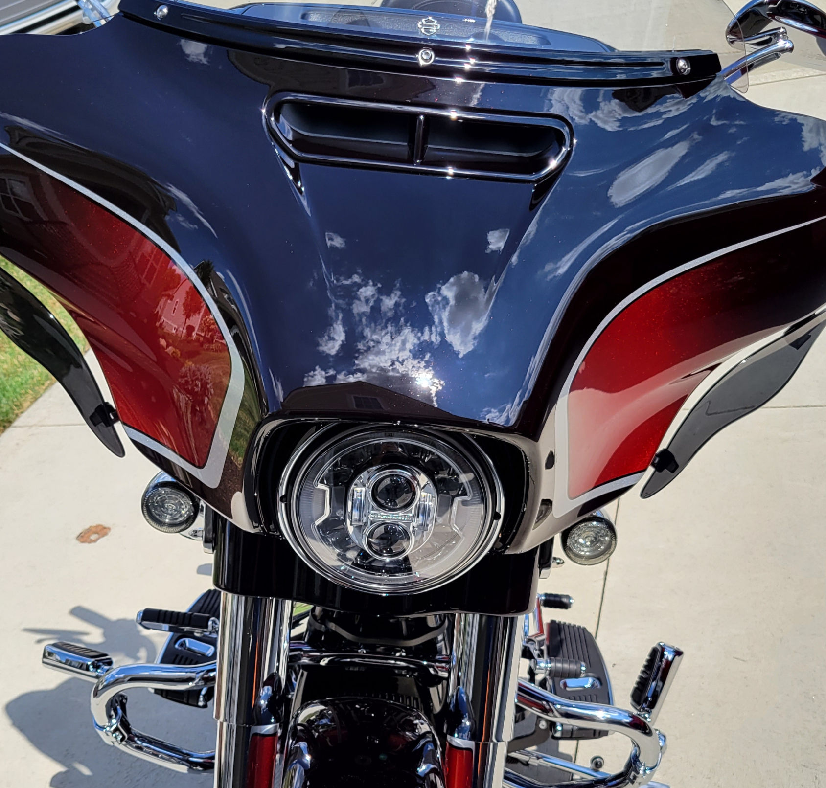 Harley-Davidson Street Glide touring motorcycle with high-gloss paint after multi-stage correction and 3-year ceramic coating