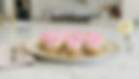 Cupcakes with pink bows on a plate