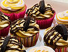 Delicious cupcakes with peanut butter frosting, chocolate drizzle, and cookies. Divine Dough.