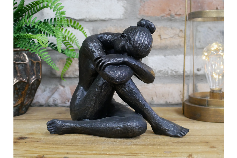 sad lady ornament lady has hair in bun