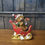 Thumbnail: Small Highland Cow in Santa’s Sleigh Figurine