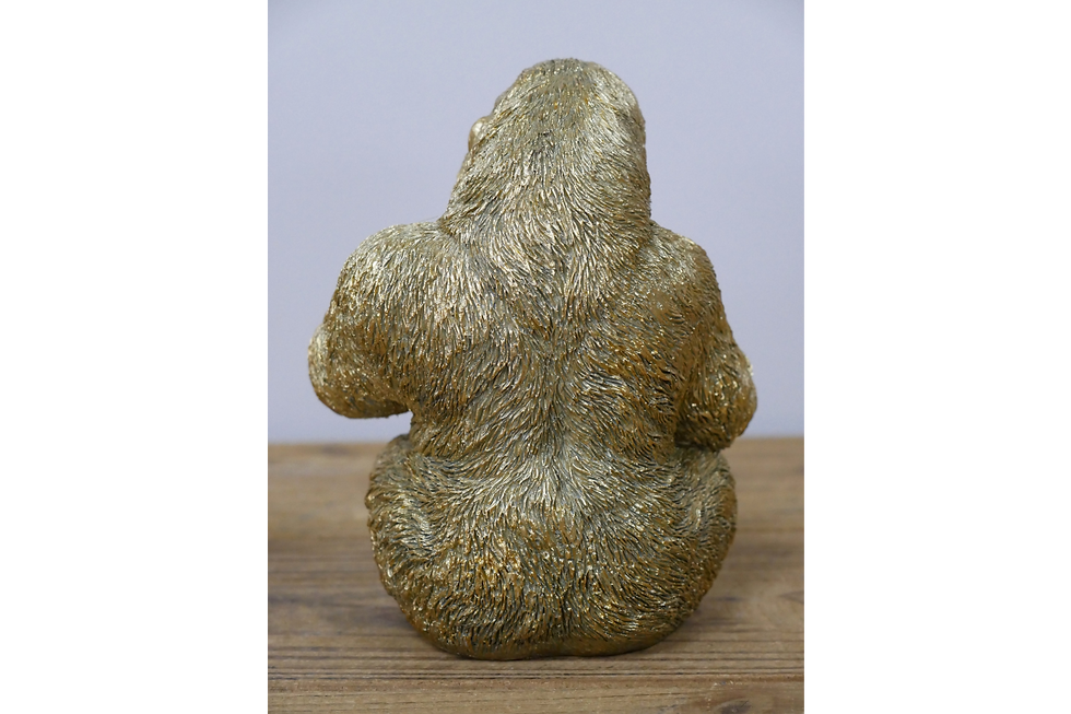 Thumbnail: Golden gorilla holding skull ornament