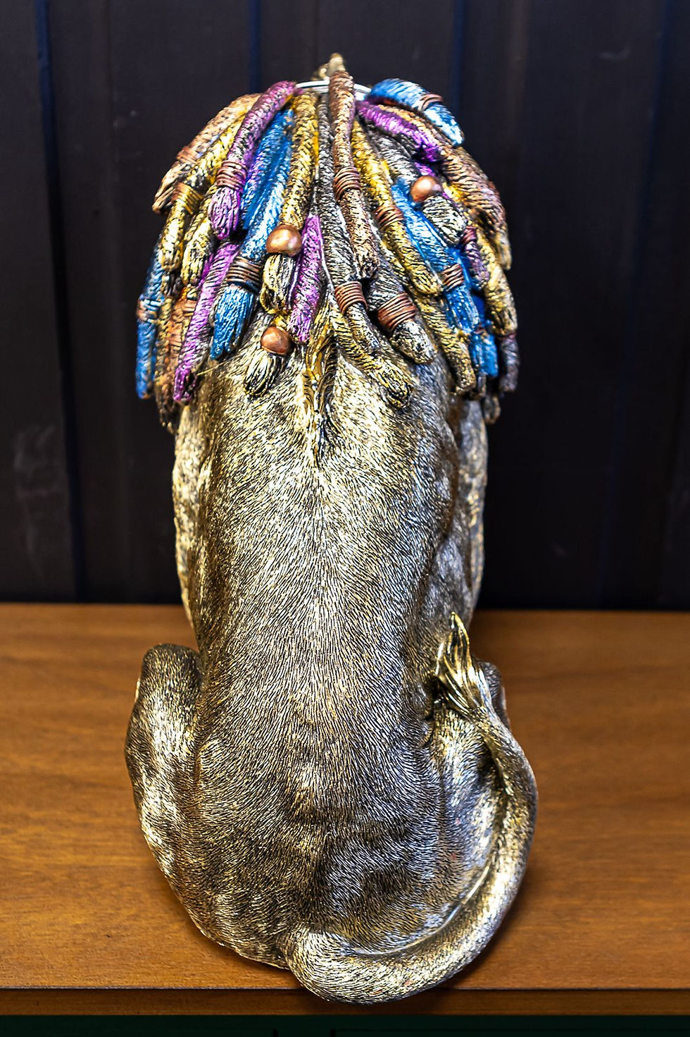 Thumbnail: lion with Bright coloured dreadlocks and golden back