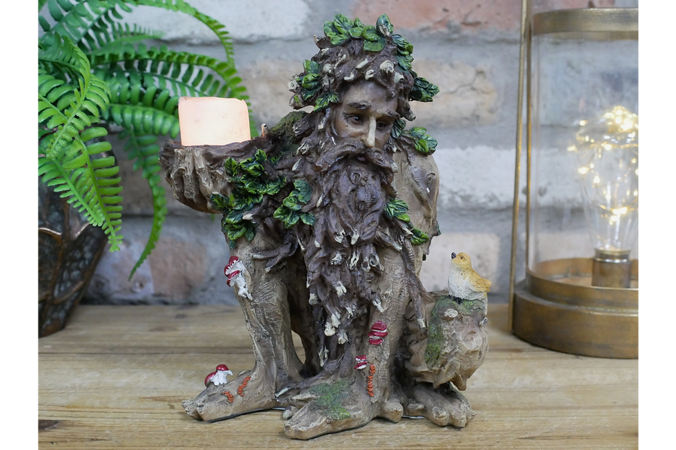 man with green leaves surrounding him and bark for skin