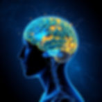 Eye-level view of a teenager sitting in a quiet room with a book and soft natural light