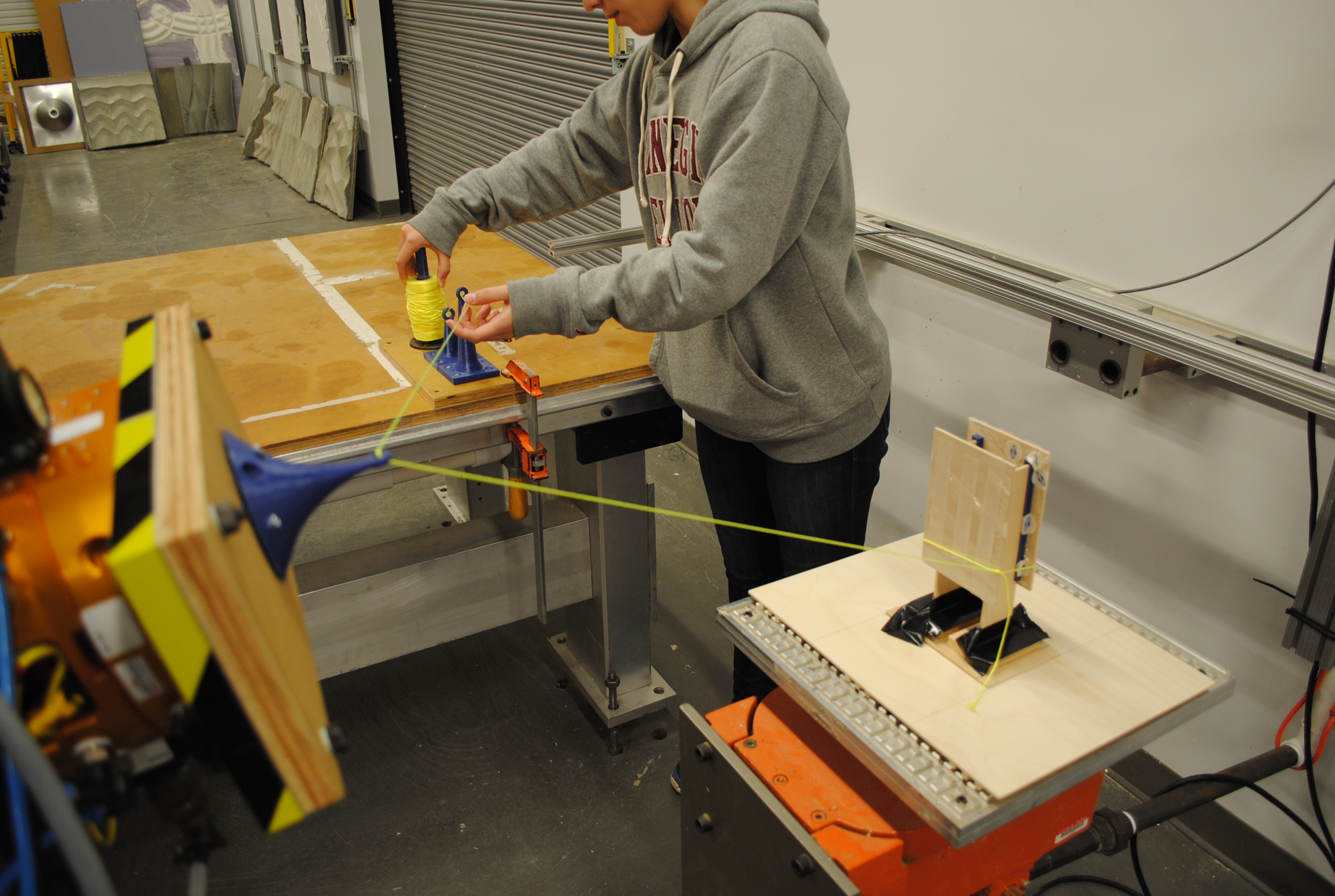 feeding the thread tensioning tool
