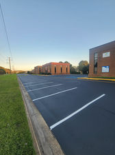 Fresh crack-fill, sealcoat and traffic paint