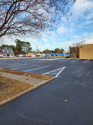 Fresh crack-fill, sealcoat and traffic paint