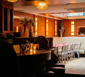 Intimate lounge seating within contemporary nightlife environment