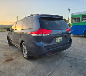 Spacious Toyota Sienna van rental Hopkins Belize with sliding doors and large cargo space