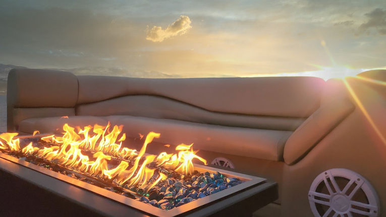 Fire pit on boat with seating at sunset kelowna luxury boat tours