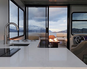 A view of the inside cabin showing the kitchen counter and sink aboard the Baby Doll, part of Kelowna Luxury Boat Tours