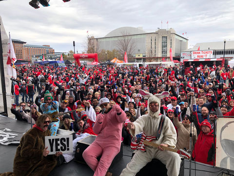 Naked Karate Girls at a Reds Fest posing with the crowd from the stage.