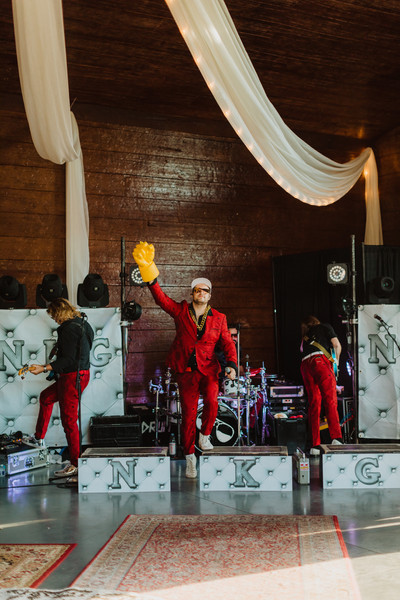 Tbone with giant fist on on wedding stage. 