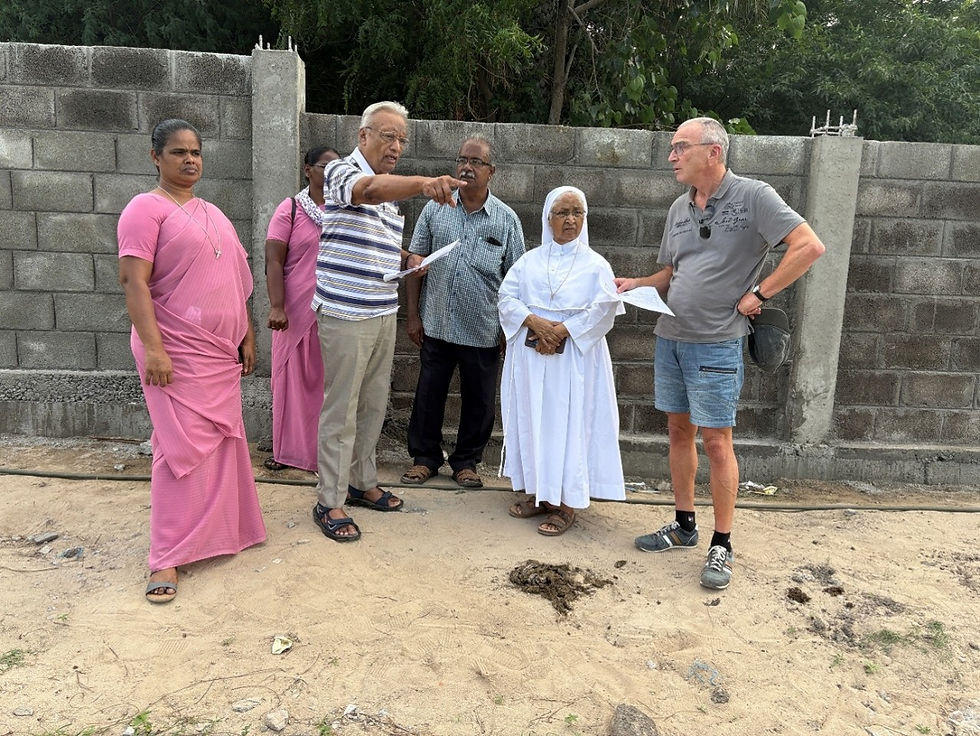 Sister Prudentia (in white) and Sister Arul Mary (far left)