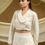 Thumbnail: Ivory Cropped Blazer Lehenga With Full Sleeve Blouse With A Skirt