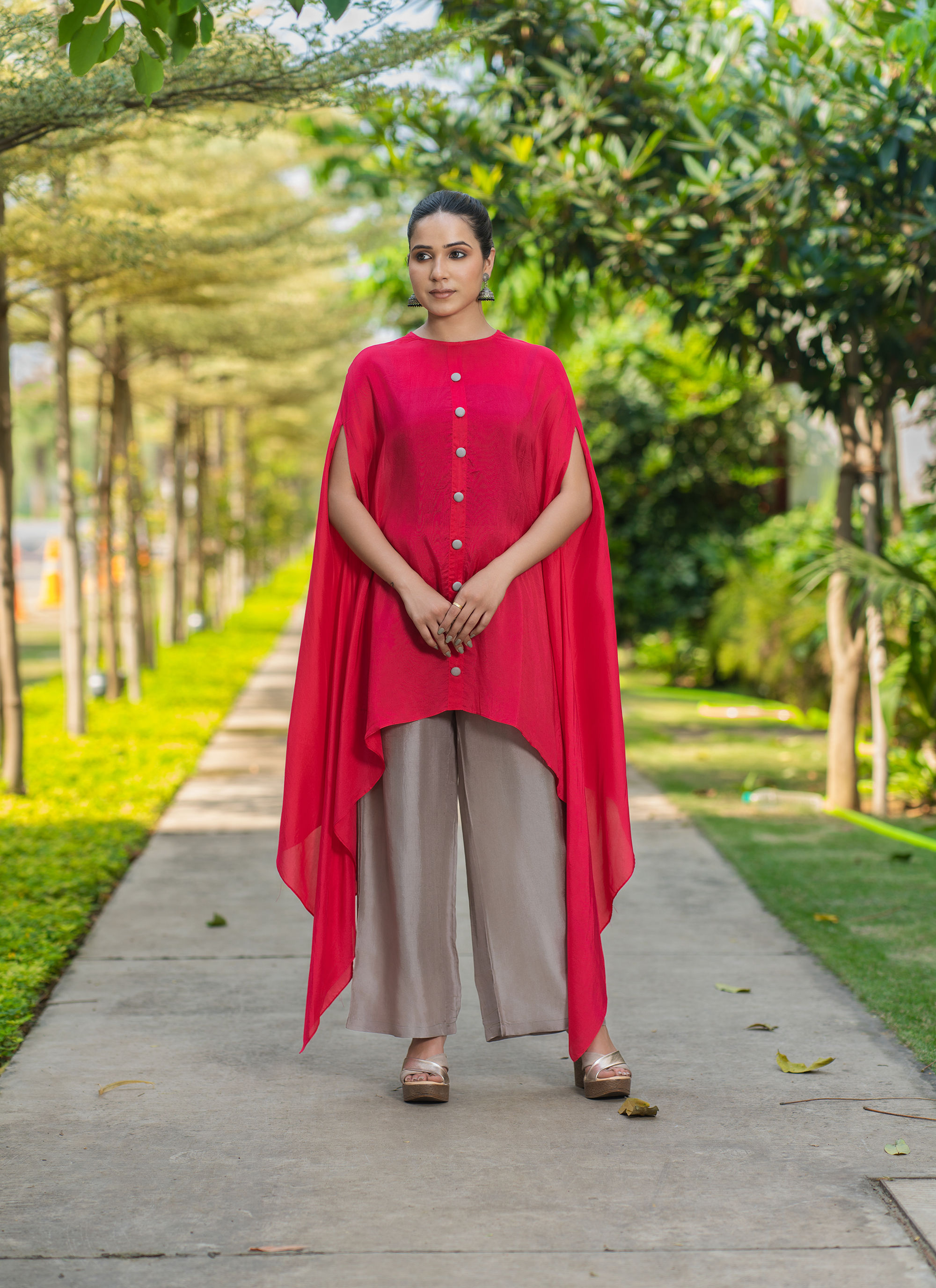 Red Top With Grey Pants And Grey Neckpiece
