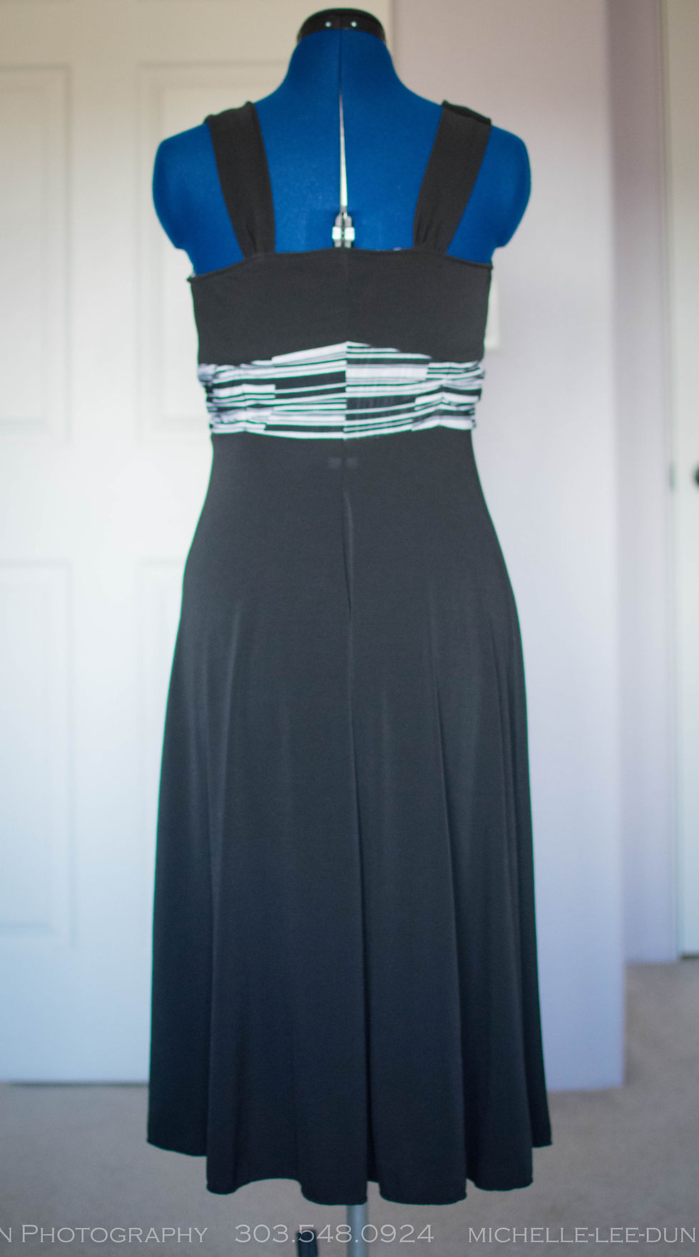 Thumbnail: Elegant Black Stretch Fabric Dress with Unique Stripe Mid-Section